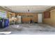 Attached garage with ample storage shelving and space for vehicles at 3722 Village Estates Pl, Tampa, FL 33618