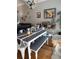 Bright dining area with a farmhouse table and bench seating at 6519 Simone Shores Cir, Apollo Beach, FL 33572