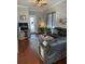 Living room with hardwood floors, comfortable seating, and a view of the entryway at 6519 Simone Shores Cir, Apollo Beach, FL 33572