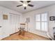 Bedroom with a rocking chair and plantation shutters at 9719 Pleasant Run Way, Tampa, FL 33647