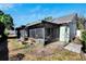 Exterior view of house with screened patio at 9719 Pleasant Run Way, Tampa, FL 33647