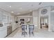 Bright kitchen with island, stainless steel appliances, and white quartz countertops at 9719 Pleasant Run Way, Tampa, FL 33647