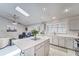 Open concept kitchen with island, stainless steel appliances, and white quartz countertops at 9719 Pleasant Run Way, Tampa, FL 33647