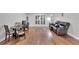 Living room with hardwood floors and a brown leather couch at 9719 Pleasant Run Way, Tampa, FL 33647