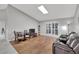 Living room with hardwood floors, skylight and brown couch at 9719 Pleasant Run Way, Tampa, FL 33647