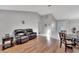 Living room with hardwood floors and a brown leather couch at 9719 Pleasant Run Way, Tampa, FL 33647