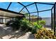 Lush, screened patio extending the living space at 9719 Pleasant Run Way, Tampa, FL 33647