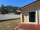 Backyard view of home with sliding glass door at 10373 137Th Ln, Largo, FL 33774