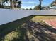 Backyard with a white vinyl fence and grassy area at 10373 137Th Ln, Largo, FL 33774