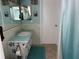 Bathroom features a vanity with turquoise countertop and shower at 10373 137Th Ln, Largo, FL 33774