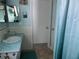 Bathroom offers a vanity with a turquoise countertop and a shower/tub combo at 10373 137Th Ln, Largo, FL 33774