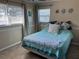 Bedroom with a queen bed and light teal bedding at 10373 137Th Ln, Largo, FL 33774