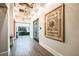 Modern hallway with hardwood floors and stylish artwork at 10884 Ibis Brook Ct, Land O Lakes, FL 34638