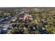 Wide aerial view showing the home and local businesses at 323 30Th N Ave, St Petersburg, FL 33704