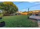 Large backyard with grassy area and a deck at 323 30Th N Ave, St Petersburg, FL 33704