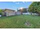 Spacious backyard with a large lawn and a deck at 323 30Th N Ave, St Petersburg, FL 33704