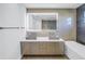 Bathroom with double vanity, concrete sinks, and a large mirror at 323 30Th N Ave, St Petersburg, FL 33704