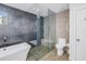 Spa-like bathroom with walk-in shower, soaking tub, and modern fixtures at 323 30Th N Ave, St Petersburg, FL 33704