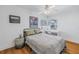 Cozy bedroom with gray blanket, wood floors, and window seat at 323 30Th N Ave, St Petersburg, FL 33704