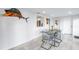 Modern dining room with glass table and chairs, near kitchen at 323 30Th N Ave, St Petersburg, FL 33704