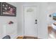 Bright entryway with white door and shoe storage at 323 30Th N Ave, St Petersburg, FL 33704