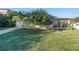 Home exterior view, featuring a covered porch and landscaping at 323 30Th N Ave, St Petersburg, FL 33704