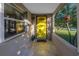 Inviting front porch with a bright yellow door and tiled flooring at 323 30Th N Ave, St Petersburg, FL 33704