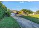 Single-story house with attached garage and a yellow front door at 323 30Th N Ave, St Petersburg, FL 33704