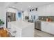 Sleek kitchen featuring white cabinets, quartz countertops, and stainless steel appliances at 323 30Th N Ave, St Petersburg, FL 33704