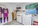 Bright laundry room with washer, dryer, and extra storage at 323 30Th N Ave, St Petersburg, FL 33704