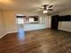 Open living room with kitchen bar and hardwood flooring at 1510 Allegheny Dr, Sun City Center, FL 33573