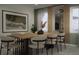 Elegant dining room with a large wooden table and modern chairs at 1520 Alameda, Spring Hill, FL 34609