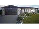 Modern two-story home with a two-car garage and landscaped front yard at 1520 Alameda, Spring Hill, FL 34609