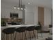 Modern kitchen with island, stainless steel appliances, and breakfast bar at 1520 Alameda, Spring Hill, FL 34609