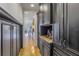Butlers pantry with dark wood cabinetry, granite countertop and ample storage at 158 Ramon Ne Way, St Petersburg, FL 33704