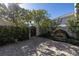 Private courtyard with fountain and wooden gate at 158 Ramon Ne Way, St Petersburg, FL 33704