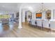 Open dining room with hardwood floors and large artwork at 158 Ramon Ne Way, St Petersburg, FL 33704