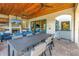 Covered patio features an outdoor kitchen with seating at 158 Ramon Ne Way, St Petersburg, FL 33704