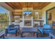 Outdoor kitchen with fireplace and TV, perfect for entertaining at 158 Ramon Ne Way, St Petersburg, FL 33704