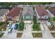 Aerial view showcasing a row of houses with red and brown roofs at 1613 Prowmore Dr, Brandon, FL 33511