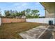 Private backyard with fenced area and concrete patio at 1613 Prowmore Dr, Brandon, FL 33511