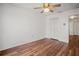 Spacious bedroom featuring wood-look floors and double-door closet at 1613 Prowmore Dr, Brandon, FL 33511