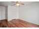 Well-lit bedroom with wood-look floors and double-door closet at 1613 Prowmore Dr, Brandon, FL 33511