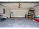 Garage with storage shelving and space for two cars at 1613 Prowmore Dr, Brandon, FL 33511