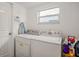 Laundry room with washer, dryer, and storage space at 1613 Prowmore Dr, Brandon, FL 33511