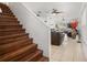View of the living room showcasing the staircase and a glimpse of the outdoor scenery at 1613 Prowmore Dr, Brandon, FL 33511