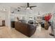 Living room with leather sofas, tile floors, and ceiling fan at 1613 Prowmore Dr, Brandon, FL 33511