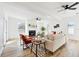 Bright living room with fireplace, hardwood floors, and access to backyard at 523 Deville E Dr, Largo, FL 33771