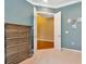 Serene bedroom with hardwood floors and access to another room at 11220 Paradise Point Way, New Port Richey, FL 34654