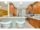 Modern kitchen with granite countertops and wood cabinets at 11220 Paradise Point Way, New Port Richey, FL 34654